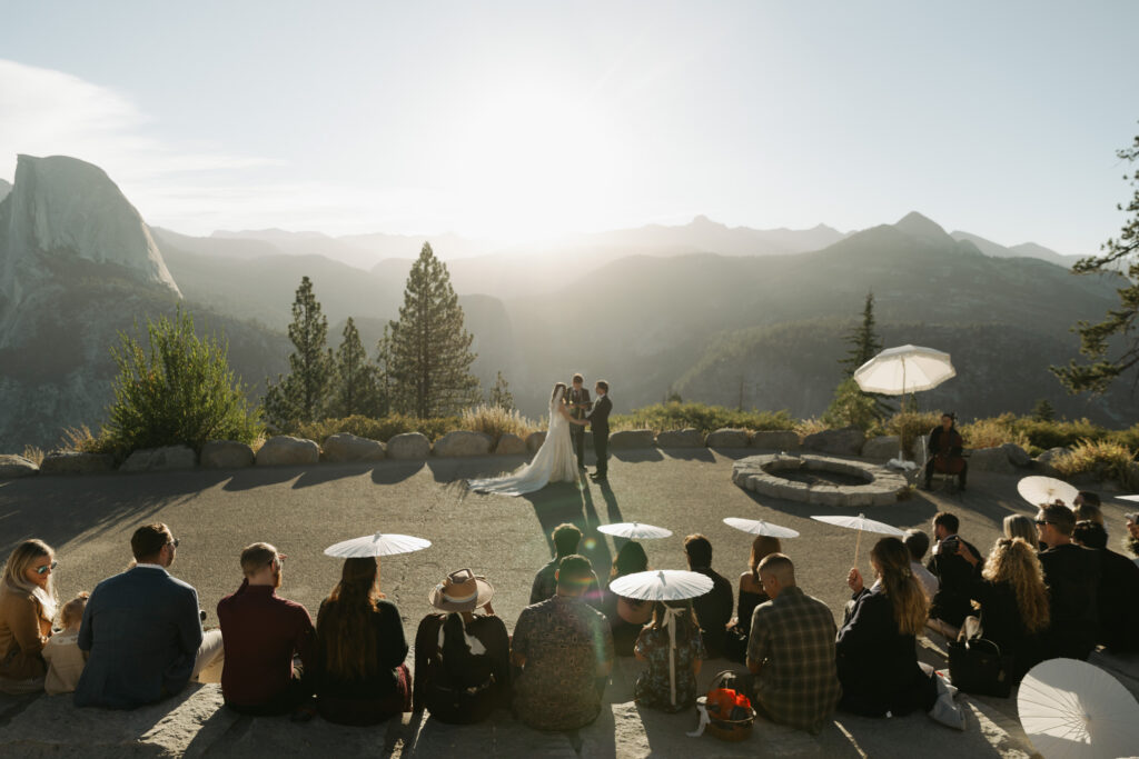 Bride and groom during their sunrise wedding ceremony at Glacier Point in Yosemite