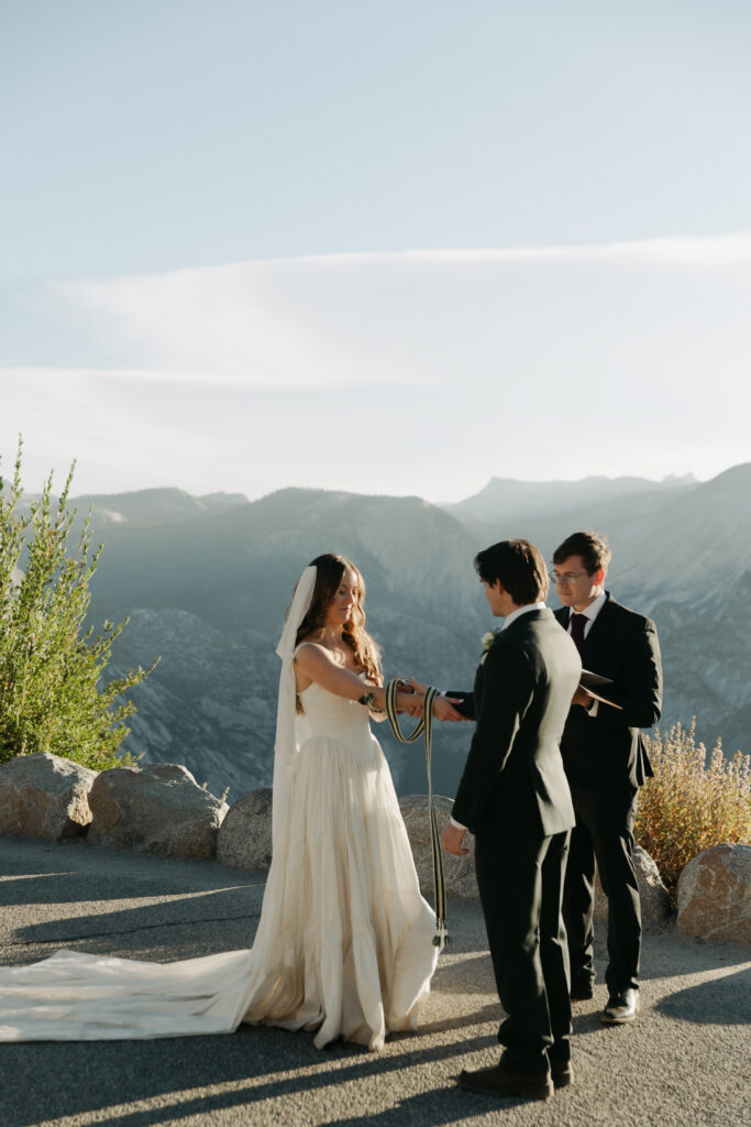 Close view of a Glacier Point elopement ceremony with Yosemite mountains in the background