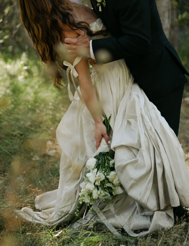 Bride and groom laughing together during romantic wedding photos in Yosemite National Park