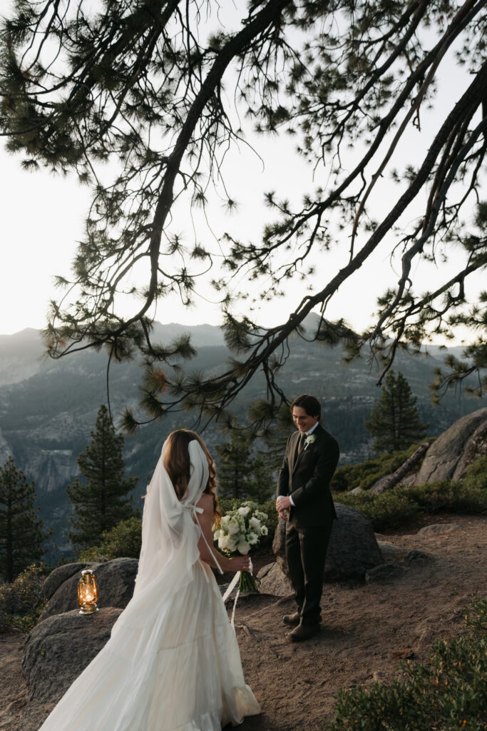 Bride and groom seeing each other during their Glacier Point sunrise first look